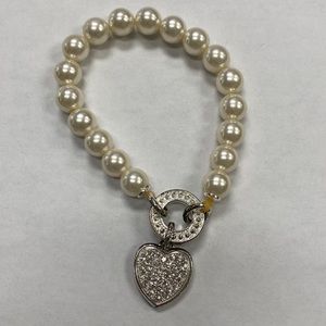 Pearl beads with heart pendant.